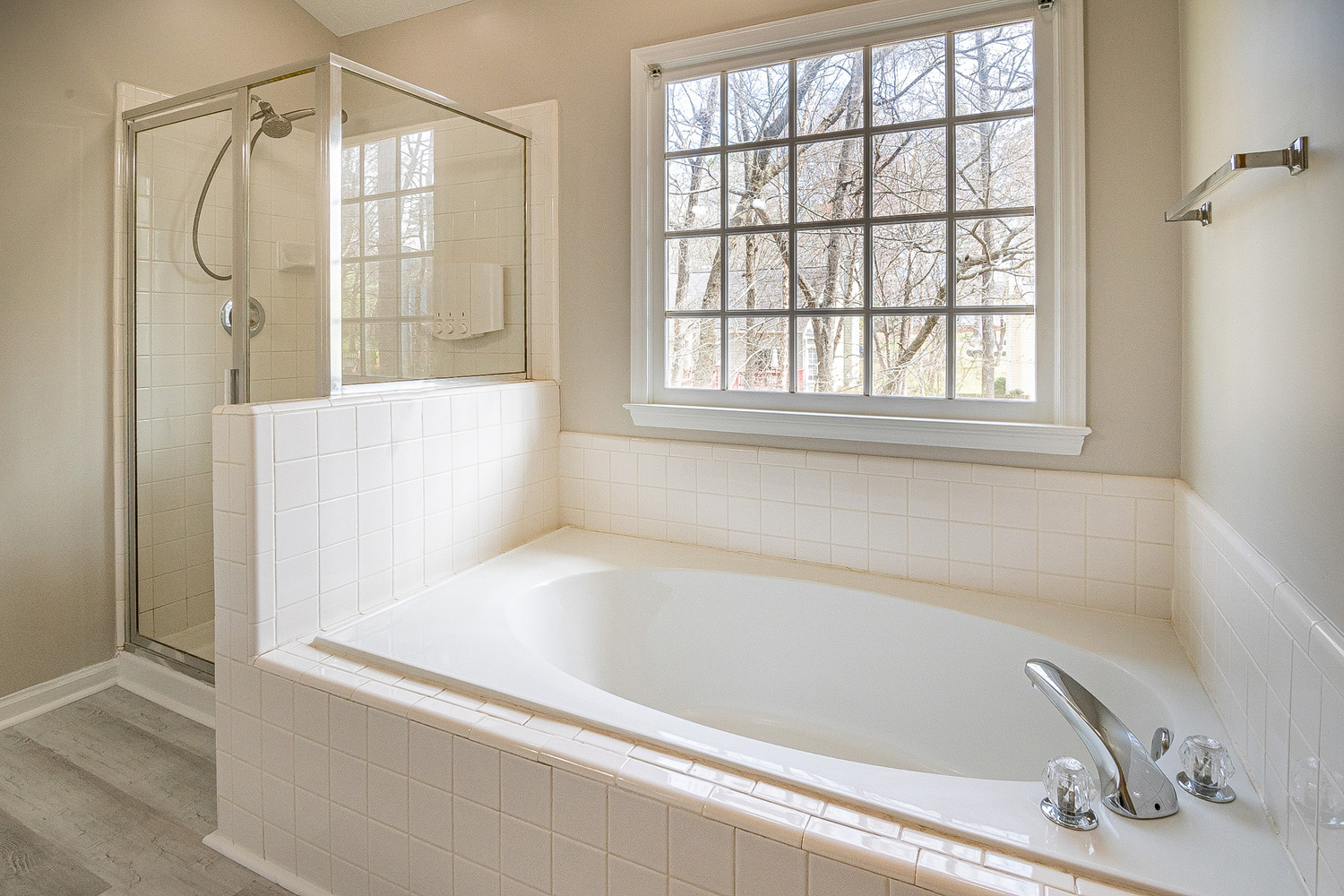 White Bathtub Near White Framed Window